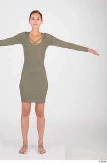 Vanessa Angel dressed green long sleeve dress standing t poses…